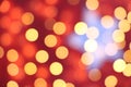 Many soft orange, red and yellow blurry bokeh light on dark red background in Christmas and New Year festival day Royalty Free Stock Photo