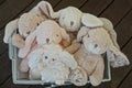 Many of soft plush toys pink and gray hares