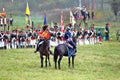 Many soldiers-reenactors fight on the battle field.