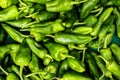 Many spicy and raw green peppers