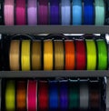 Many spools of multi-colored plastic for 3D printing Spools of pink red burgundy Royalty Free Stock Photo