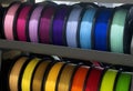 Many spools of multi-colored plastic for 3D printing Spools of pink red burgundy Royalty Free Stock Photo