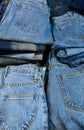 Many stacked blue Jeans background