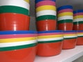 Many stacked colorful plastic bowls, kitchenware in a store Royalty Free Stock Photo