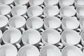 Many stacked in rows of empty clean white cups Royalty Free Stock Photo