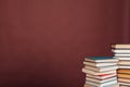 Many stacks of educational books for exams in the library on the brown background of the university Royalty Free Stock Photo