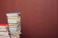 Many stacks of educational books for exams in the library on the brown background of the university Royalty Free Stock Photo