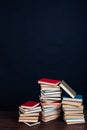 Many stacks of educational books to teach in the library on a black background Royalty Free Stock Photo