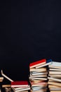 Many stacks of educational books to teach in the library on a black background Royalty Free Stock Photo