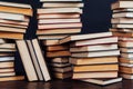 Many stacks of educational books to teach in the library on a black background Royalty Free Stock Photo