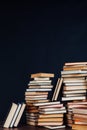 Many stacks of educational books to teach in the library on a black background Royalty Free Stock Photo