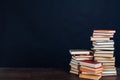 Many stacks of educational books to teach in the library on a black background Royalty Free Stock Photo