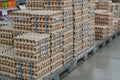 Many stacks of rows and paper packaging for chicken eggs, stacked in a store, brought from poultry farms in rural areas