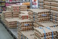 Many stacks of rows and paper packaging for chicken eggs, stacked in a store, brought from poultry farms in rural areas