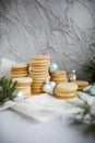 Many stacks of shortbread cookies on a concrete background