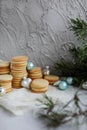 Many stacks of shortbread cookies on a concrete background