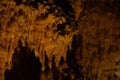 Many stalactite formations in cave, closeup view