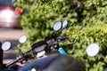 Many street-side scooter mirrors parked against a defocused urban background Royalty Free Stock Photo