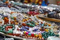 Many strings of colorful beads made of natural stones