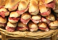 Stuffed sandwiches with bacon in the picnic basket Royalty Free Stock Photo