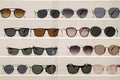 Many sunglasses on display in shop. Display of colorful sunglasses for sale in a street Royalty Free Stock Photo