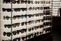 Many sunglasses on display in shop. Fashion Sunglasses in shop Royalty Free Stock Photo