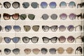 Many sunglasses on display in shop. Fashion Sunglasses in shop Royalty Free Stock Photo