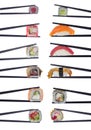 Many sushi rolls in chopsticks isolated on white