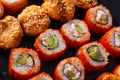 Many sushi and rolls , set of Japanese rolls California with caviar, Philadelphia with salmon, baked with cheese and eel, on a