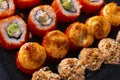 Many sushi , set of baked rolls with cheese and eel, Japanese rolls California with caviar, Philadelphia with salmon, on