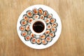 Many sushi slices served on white plate with soy sauce Royalty Free Stock Photo