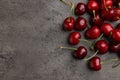 Many sweet cherries on grey table, flat lay. Space for text Royalty Free Stock Photo