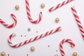 Many sweet Christmas candy canes and decor on white background, flat lay Royalty Free Stock Photo