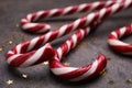 Many sweet Christmas candy canes and shiny confetti on grey background, closeup Royalty Free Stock Photo