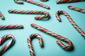 Many sweet Christmas candy canes on turquoise background Royalty Free Stock Photo