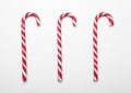 Many sweet Christmas candy canes on white background, flat lay Royalty Free Stock Photo