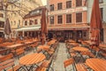 Many tables of the historical beer bar in old bavarian city Royalty Free Stock Photo