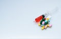 many tablets and pill on spoon and liquid drug in syringe Royalty Free Stock Photo