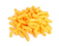 Many tasty cheesy corn puffs isolated on white, top view Royalty Free Stock Photo