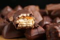 Many tasty chocolate bars on table, closeup