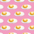 Many tasty fried chicken eggs on pink background