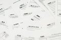 Many tax form blanks lies on table close up. Tax payers paperwork routine and bureaucracy concept Royalty Free Stock Photo