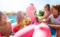 Many kids chat, drink soda celebrating in the pool Royalty Free Stock Photo