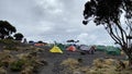 Many tents are in the campground. Shira Cave Camp. Mountain landscape. Climbing Kilimanjaro, Africa