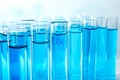 Many test tubes with blue liquid