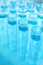 Many test tubes with light blue liquid Royalty Free Stock Photo