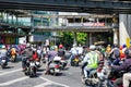 Many Thais ride mopeds and motorbikes