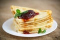 Many thin pancakes with jam Royalty Free Stock Photo