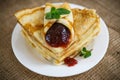Many thin pancakes with jam Royalty Free Stock Photo