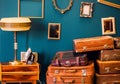 Many things - suitcases, a lamp, an iron, photo frames - in one room Royalty Free Stock Photo